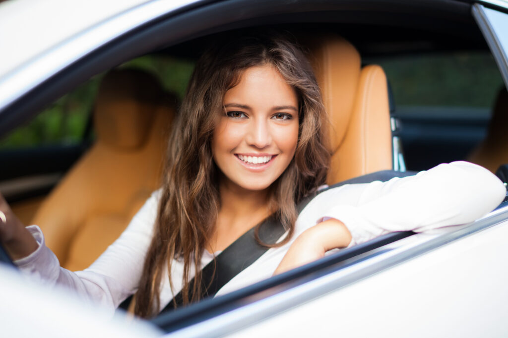 Young woman driving her car